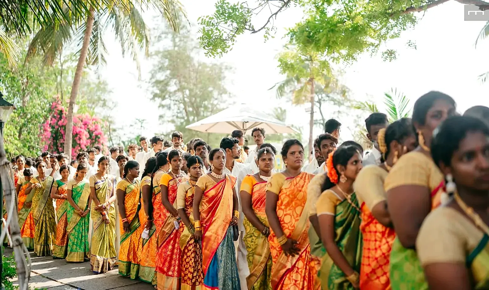 101 couples in wedding attire walk in procession at the world-record mass wedding