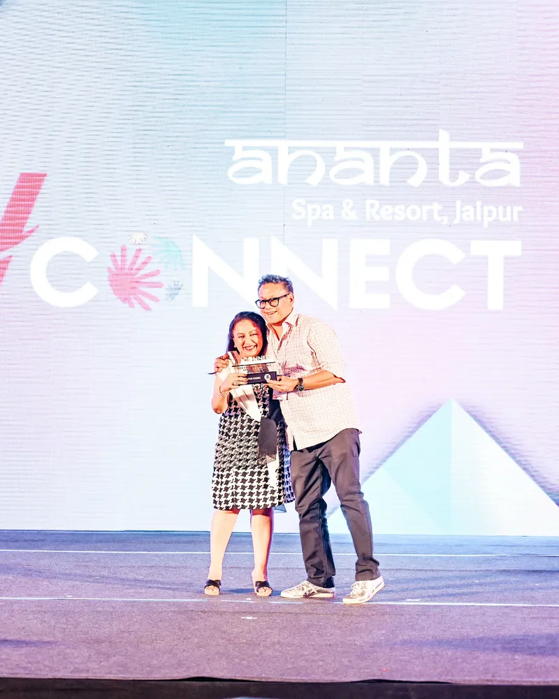 A winner receiving her award on the WV Connect stage